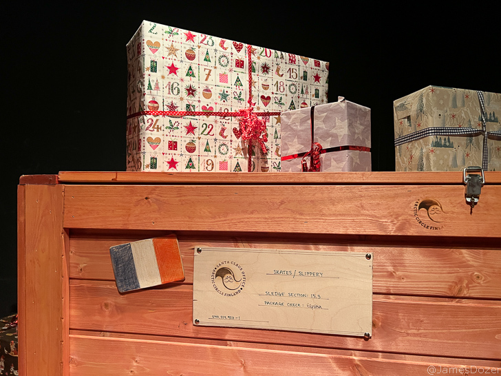 a wooden box with presents on top