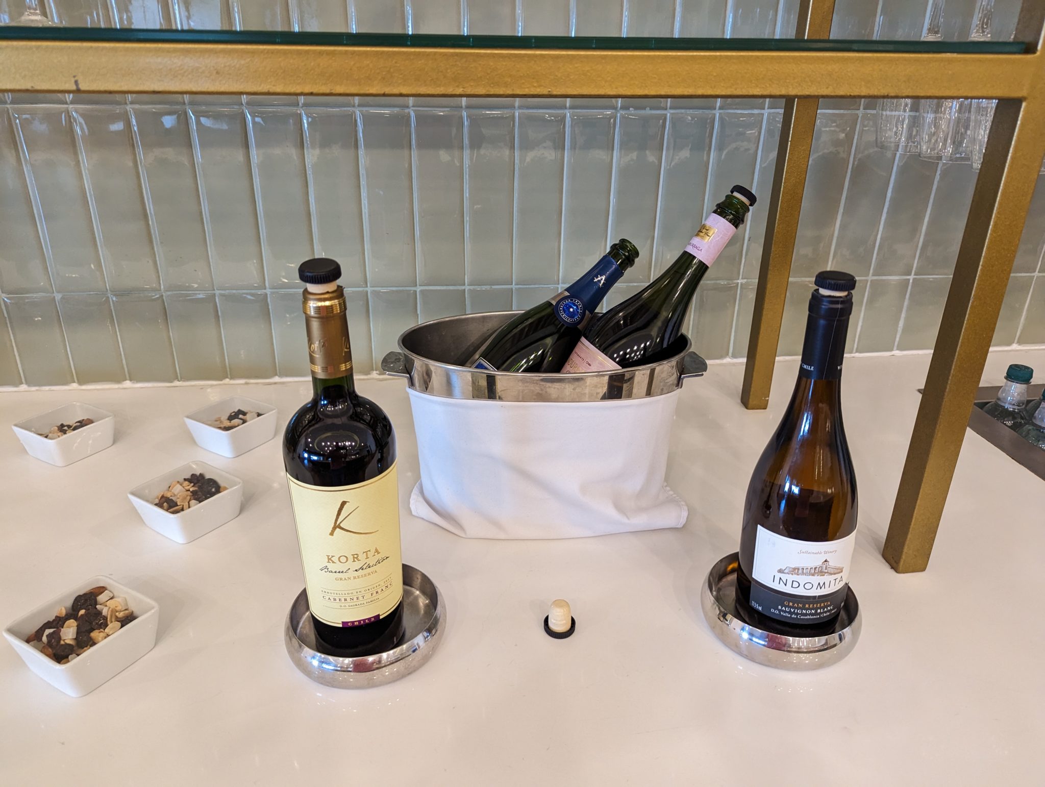 bottles in a bucket on a table
