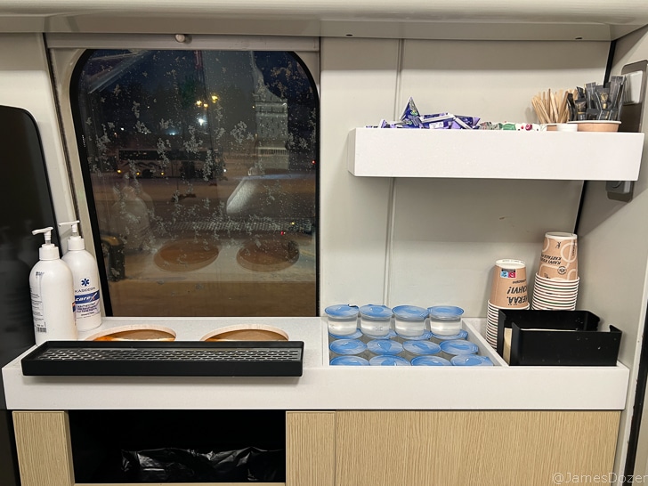 a counter with a window and a few items on it
