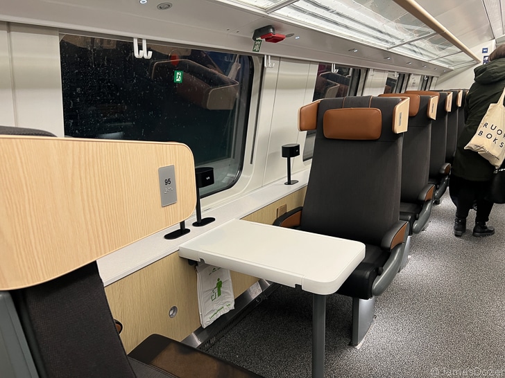 a train with seats and a table