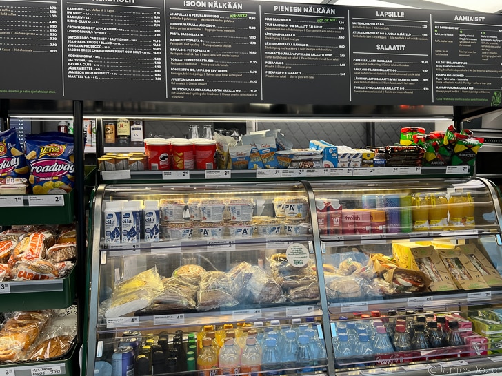 a display case with food and drinks