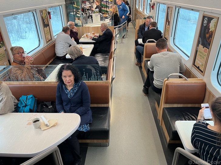 a group of people sitting in a restaurant
