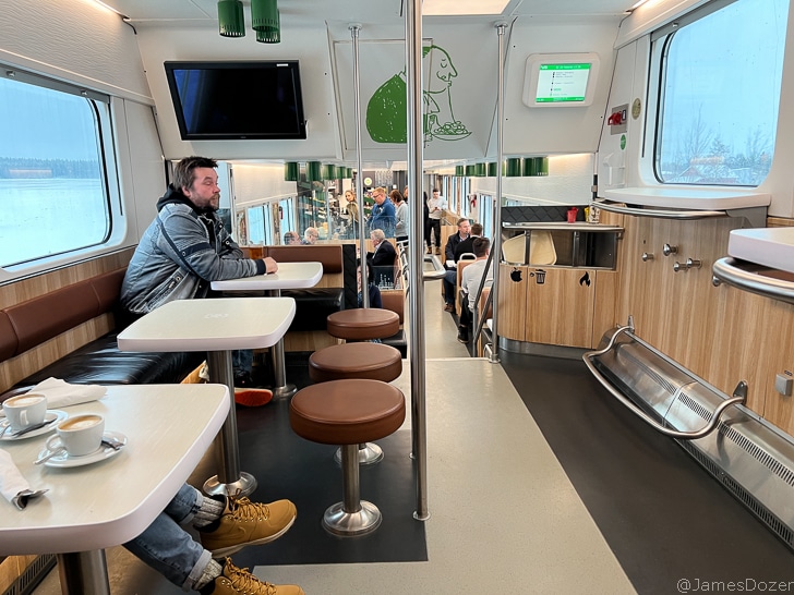 a man sitting at a table in a bus