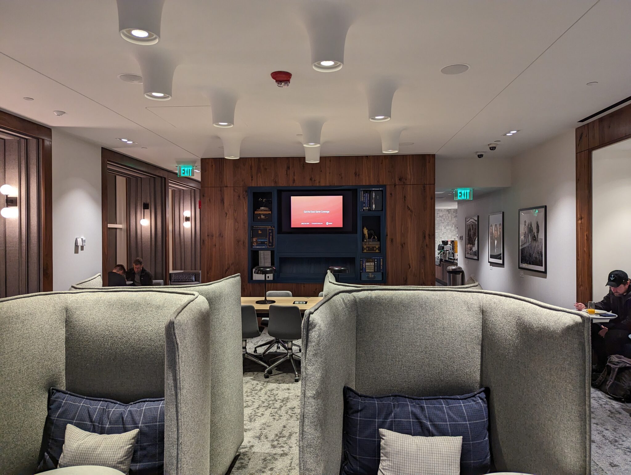 a room with chairs and a television
