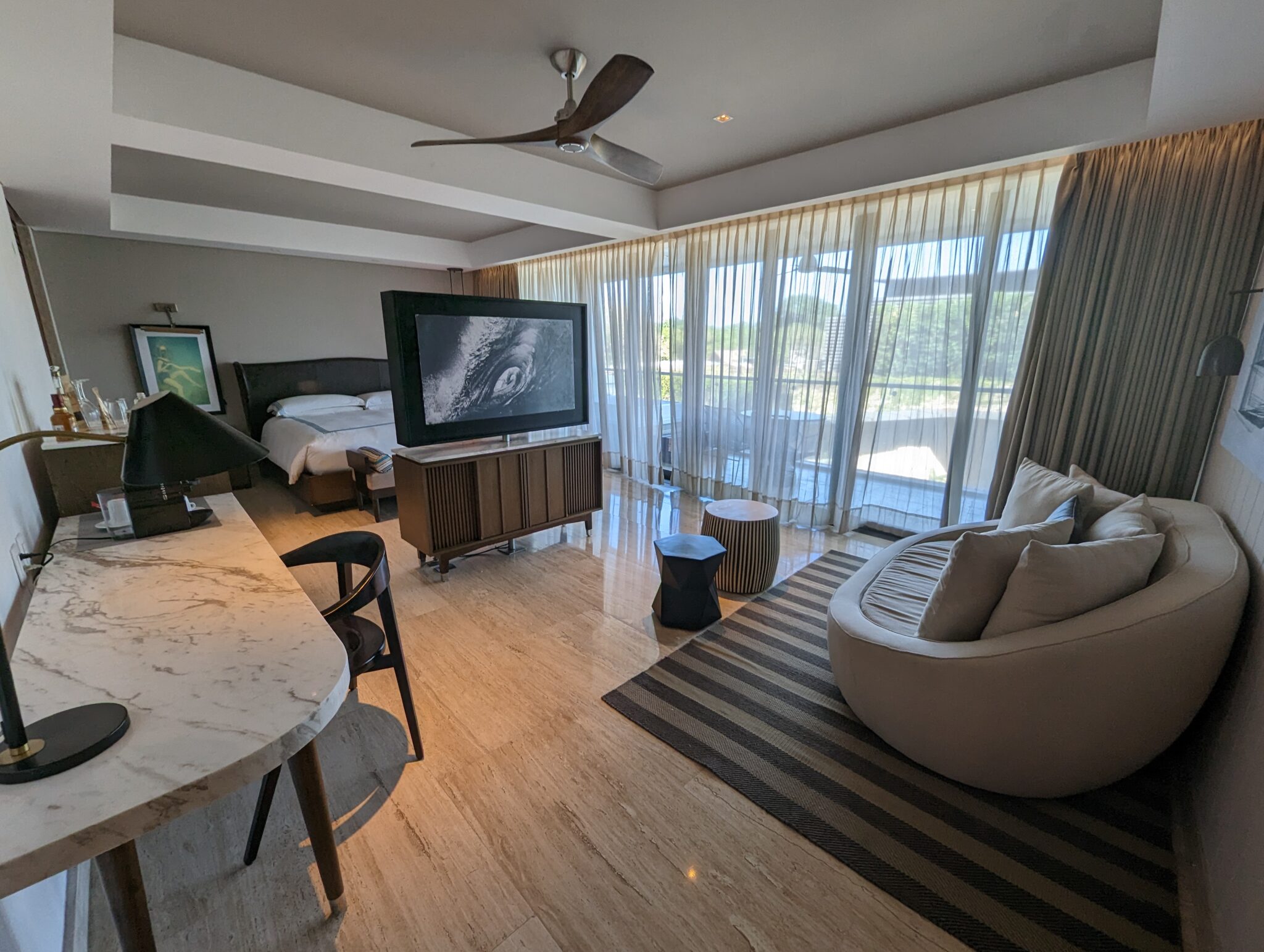 a room with a television and a bed