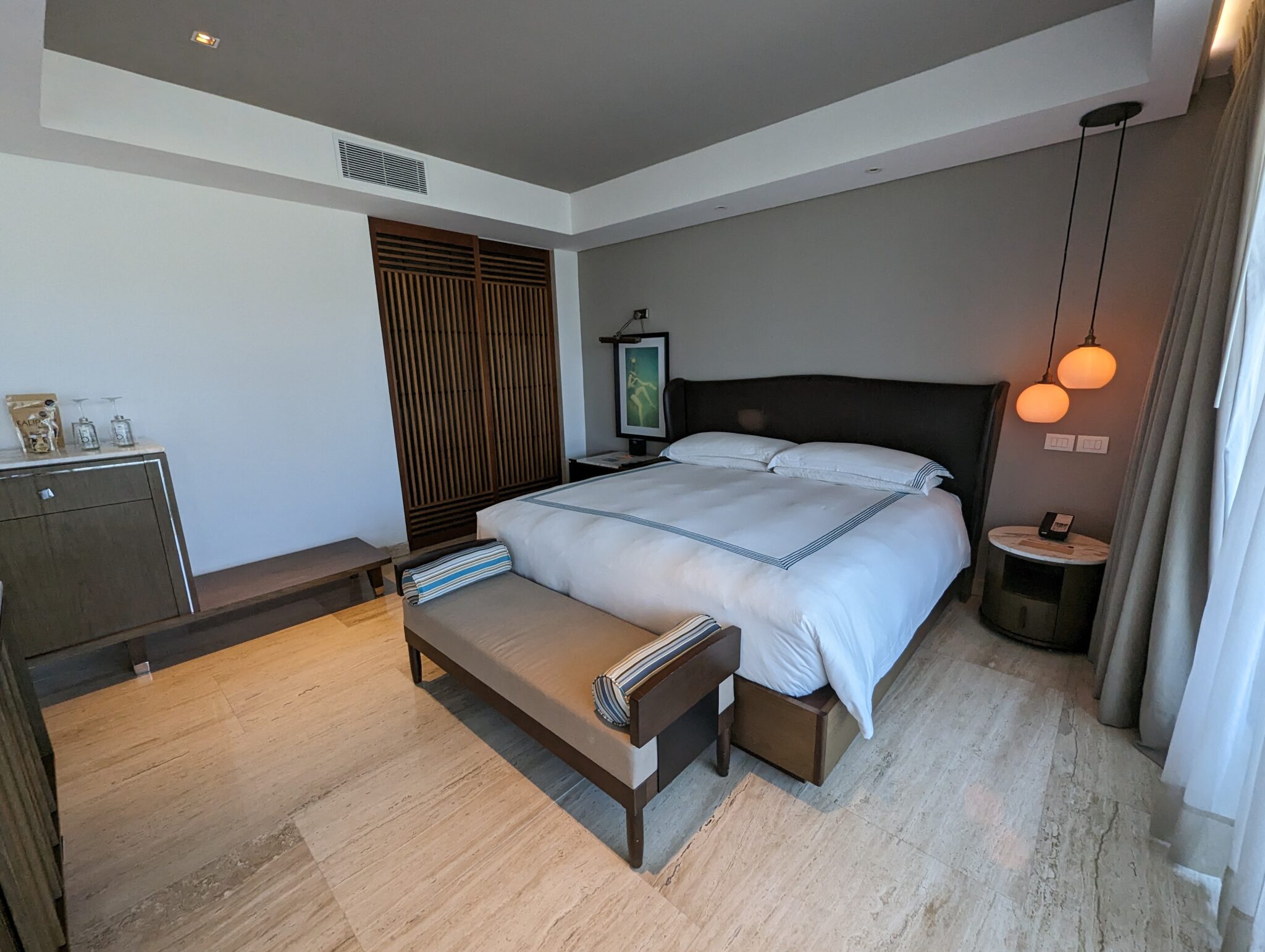 a bedroom with a bed and a table