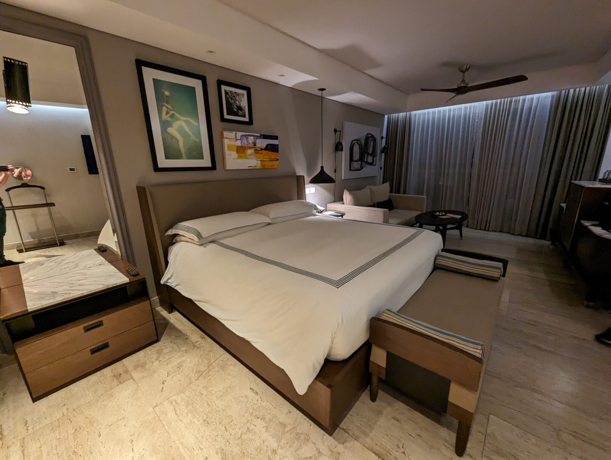 a bedroom with a bed and a couch