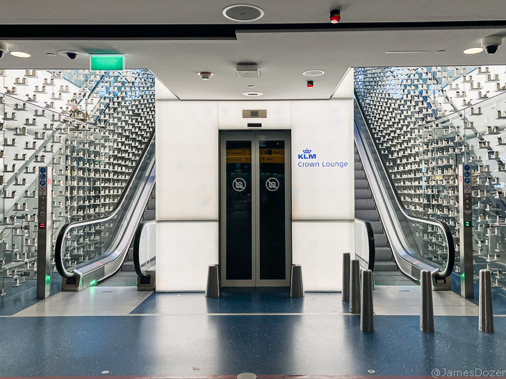 an elevator with escalators in a building
