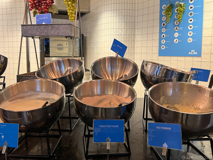 a group of bowls with brown liquid in them