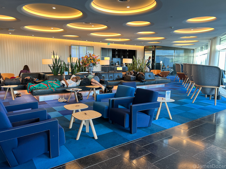 a room with blue chairs and tables