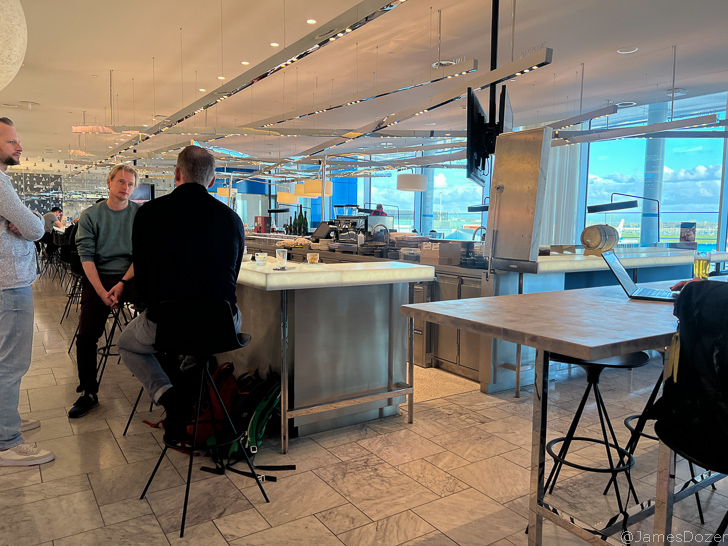 a group of people sitting in a kitchen