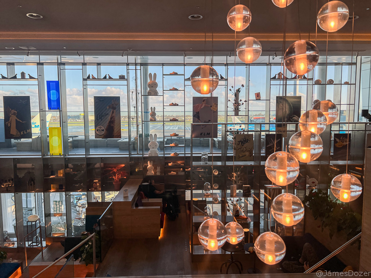 a glass wall with lights and a window