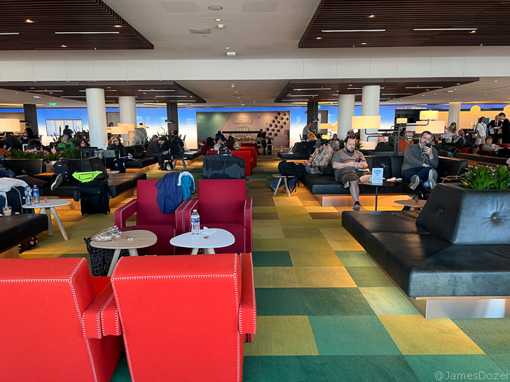 a group of people sitting in a lounge area