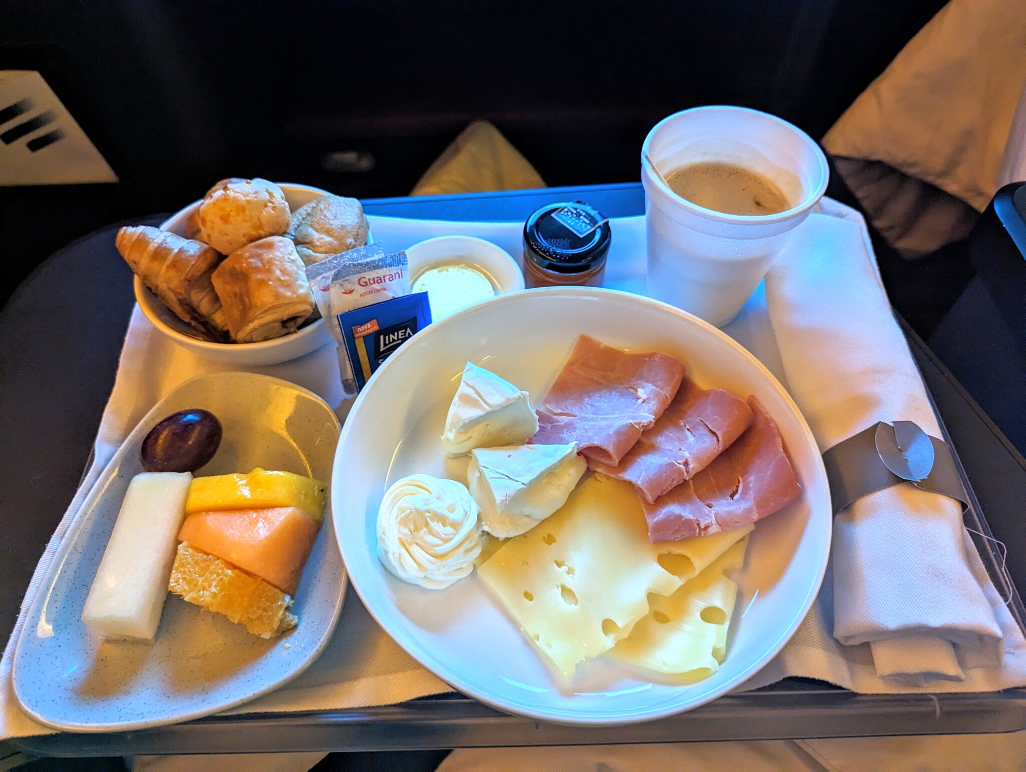 a tray with food and a cup of coffee