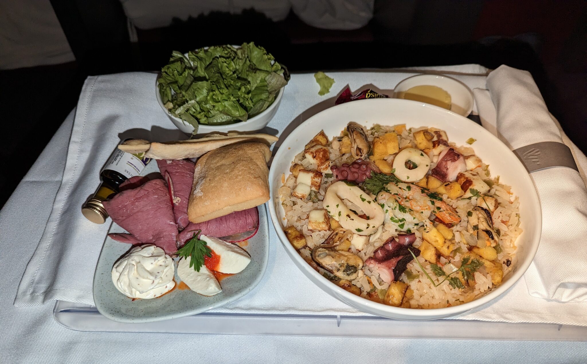 a plate of food and a bowl of salad