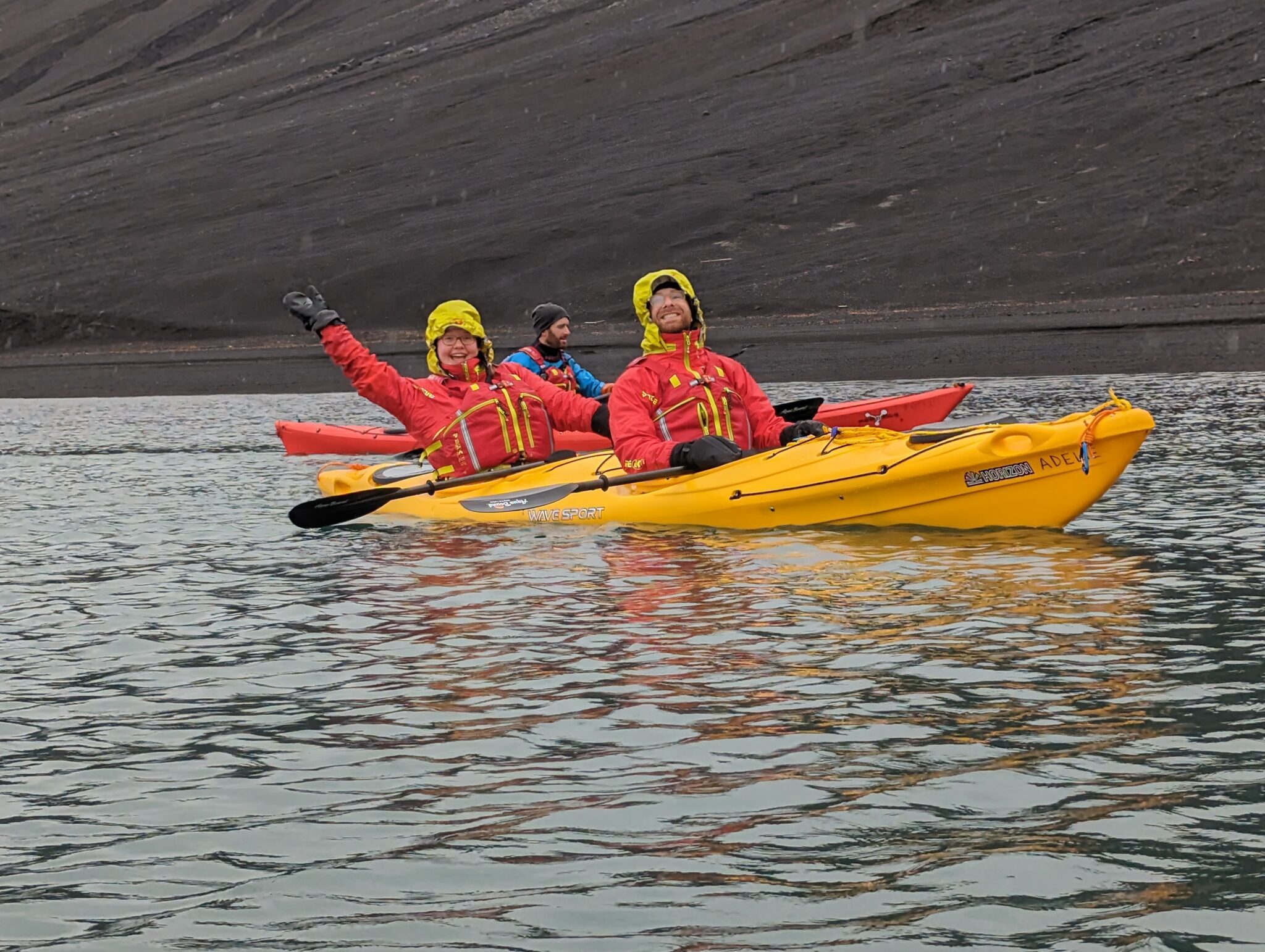 a group of people in a kayak