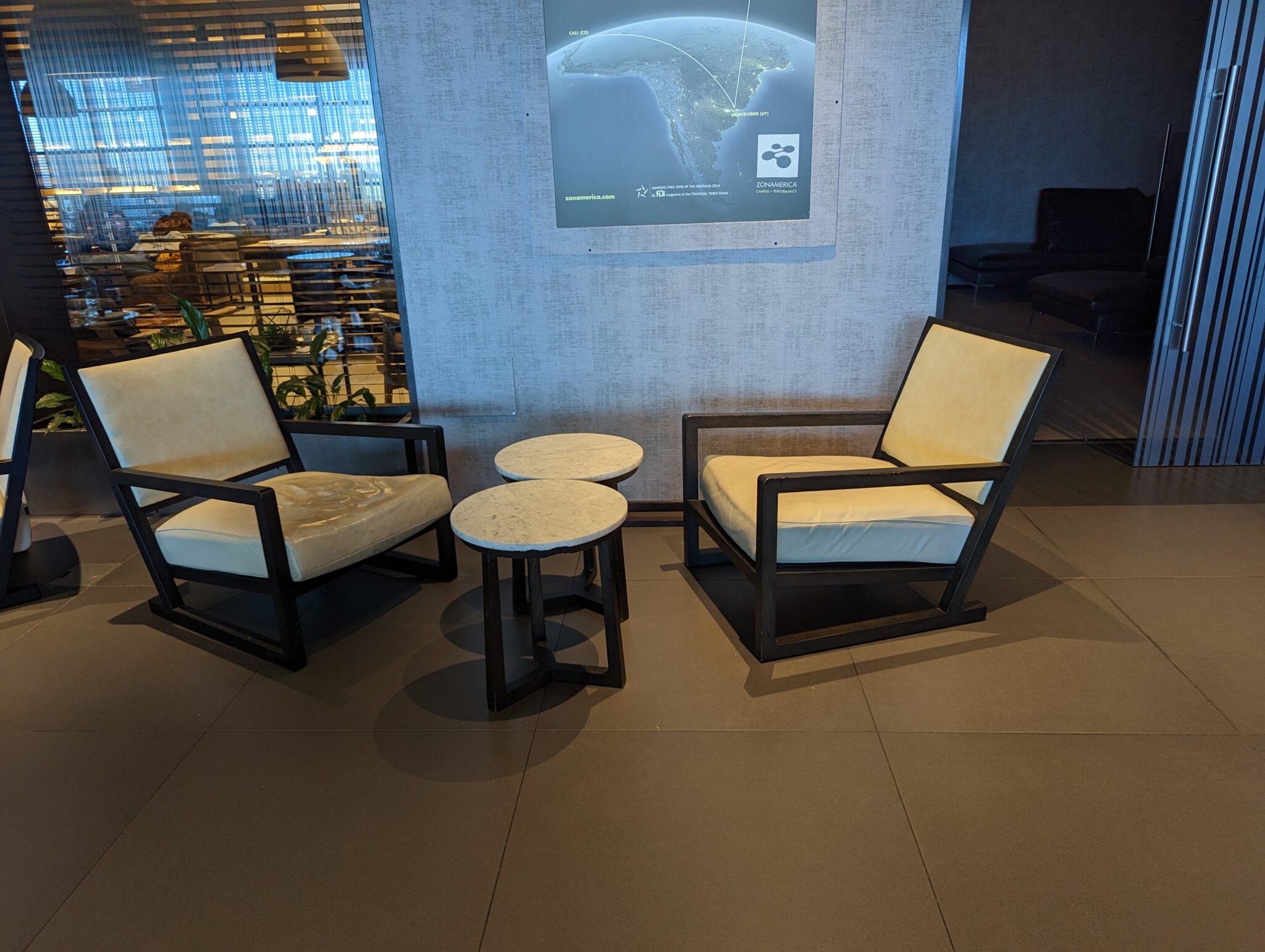 a group of chairs and a table in a room