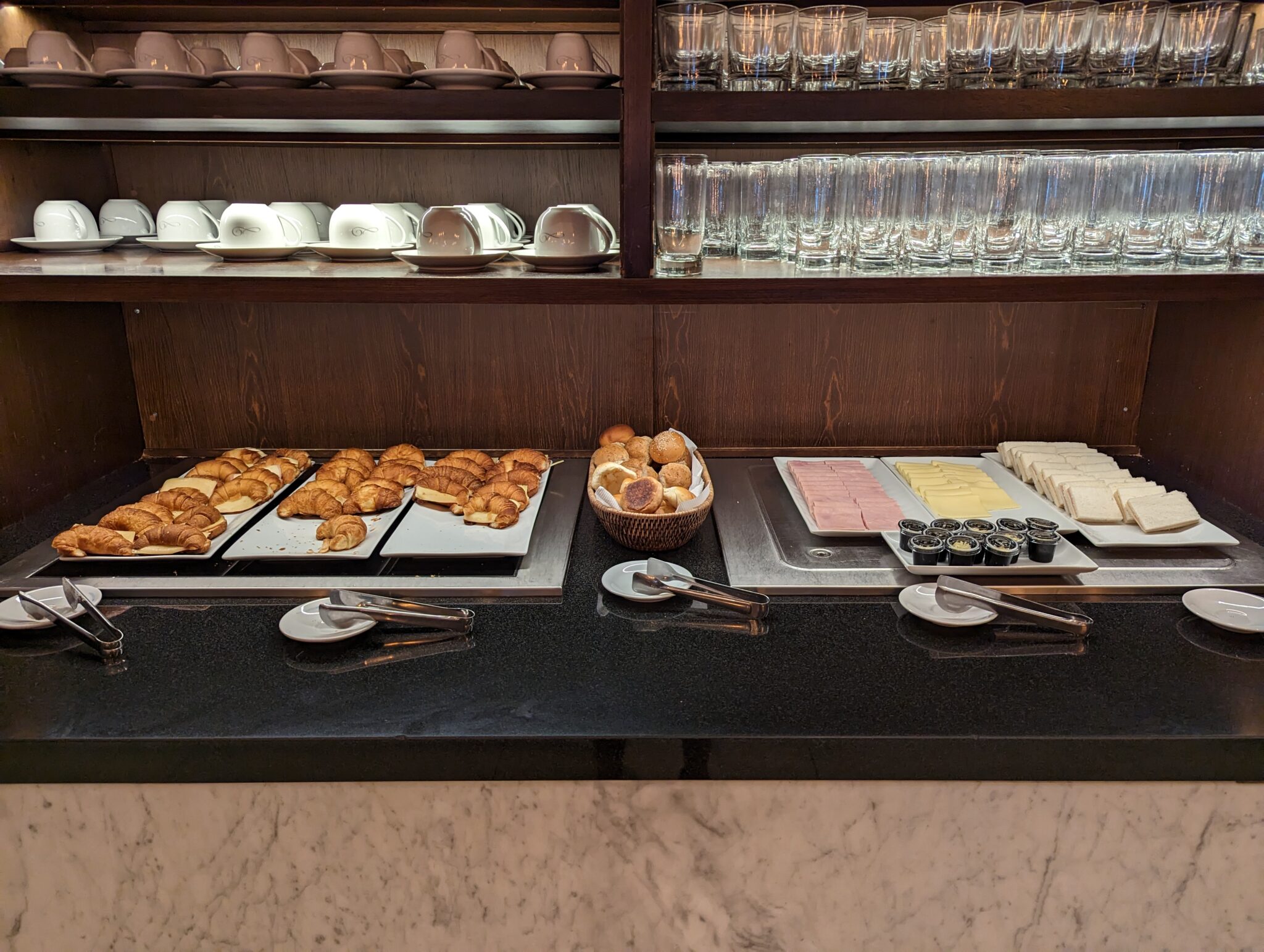 a buffet with different types of food on plates
