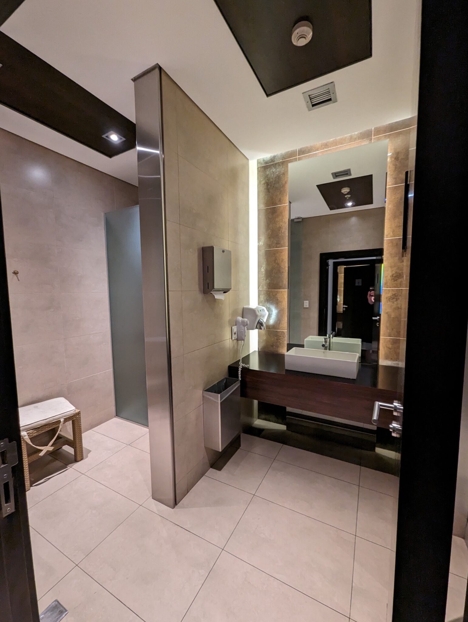 a bathroom with a mirror and a sink