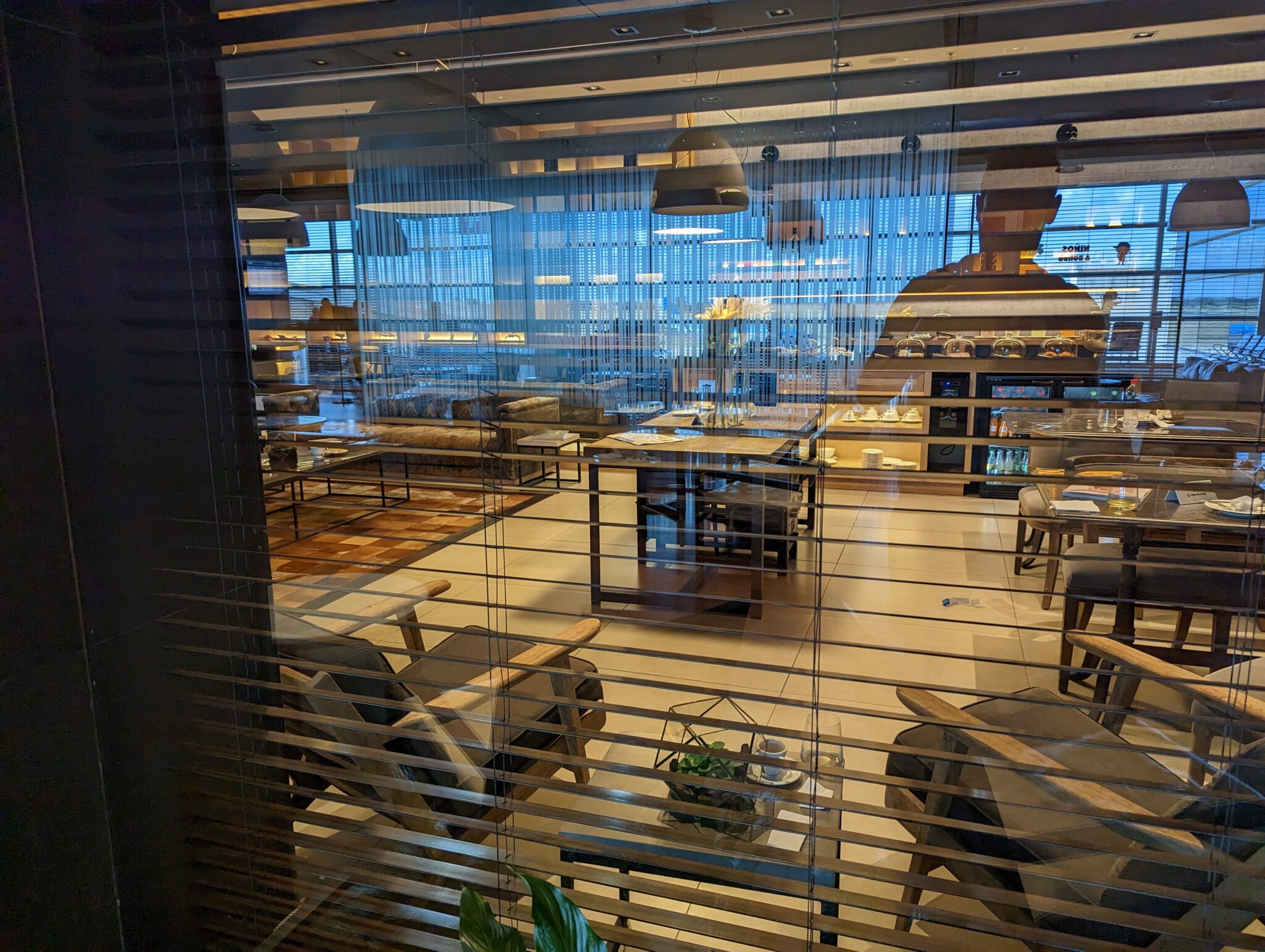 a room with a window and a person sitting on it