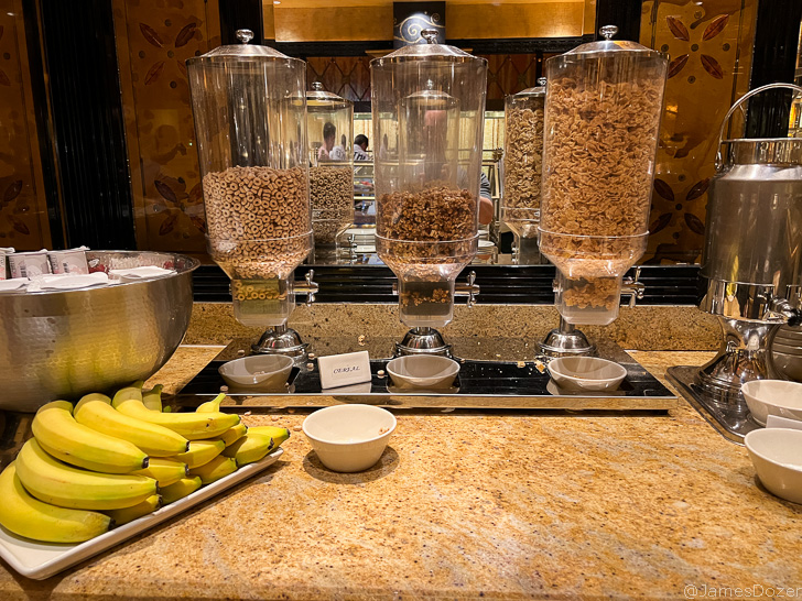 a group of cereals and bananas on a counter