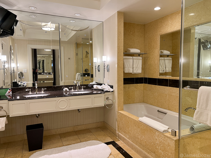 a bathroom with a large shower and sink