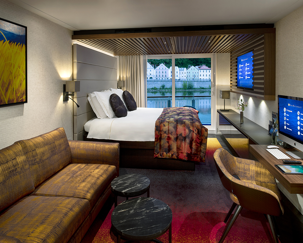 a room with a bed and a television