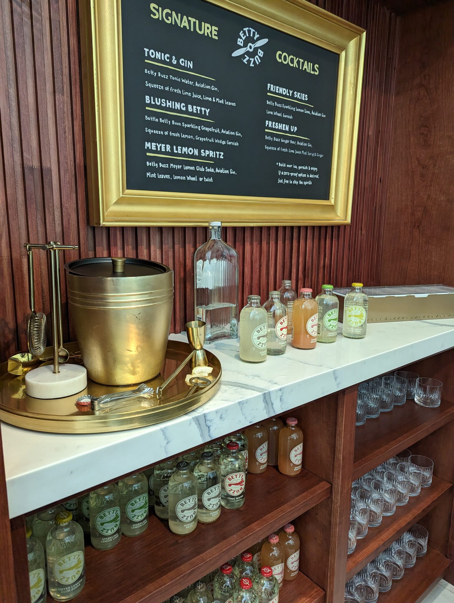 a bar with bottles and glasses on a counter