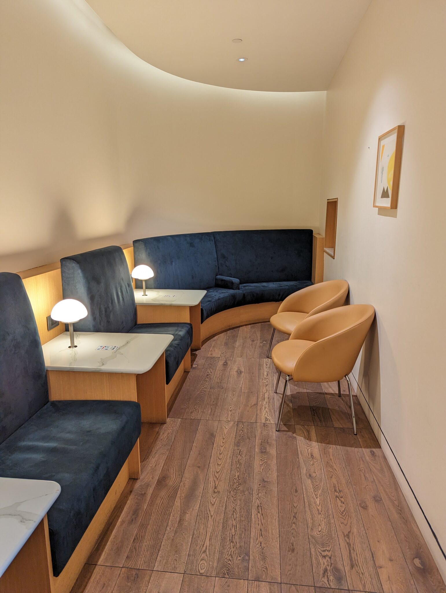 a room with blue couches and chairs