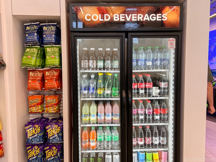 a refrigerator with drinks and snacks