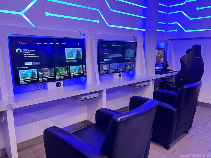 a room with a computer and monitors