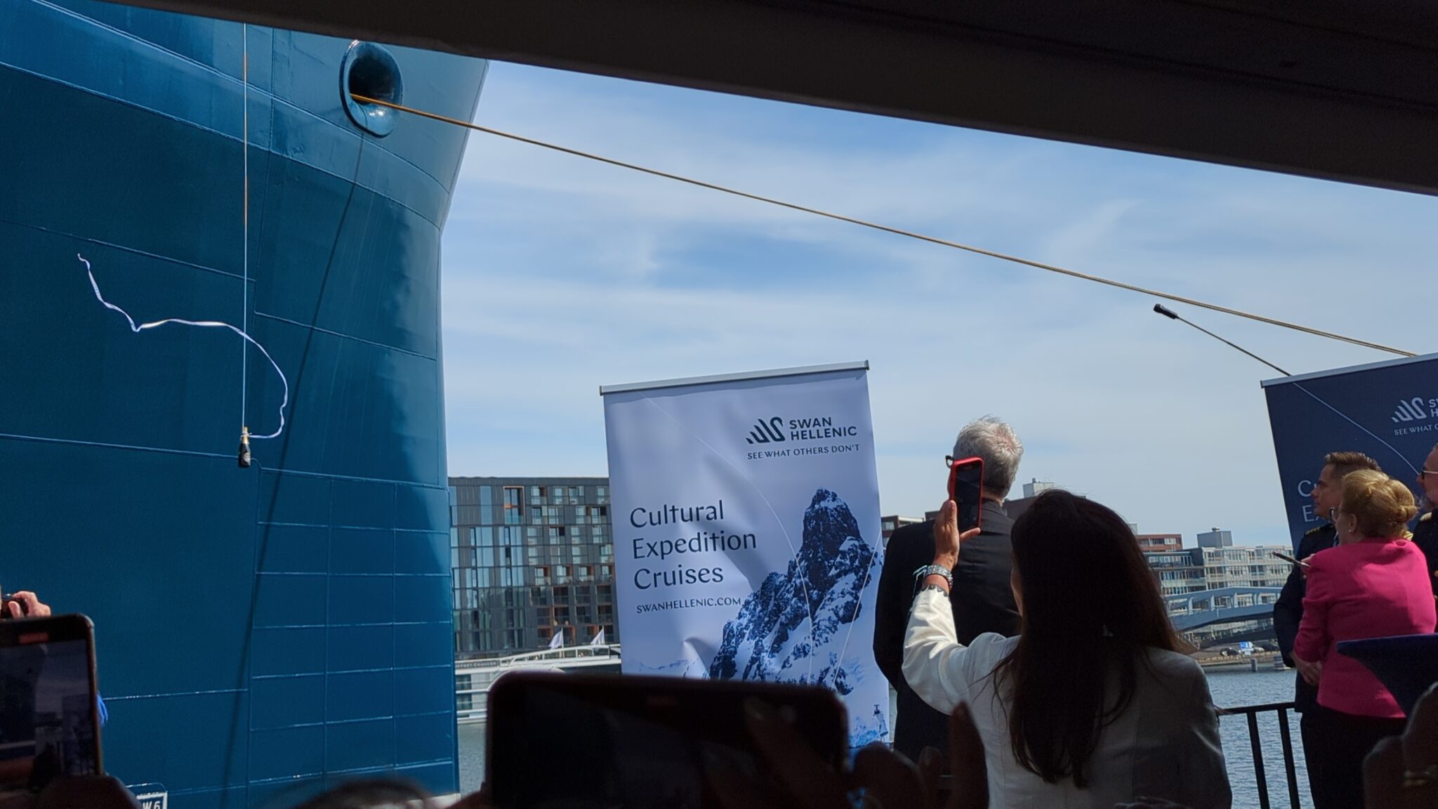 a group of people taking a picture of a ship