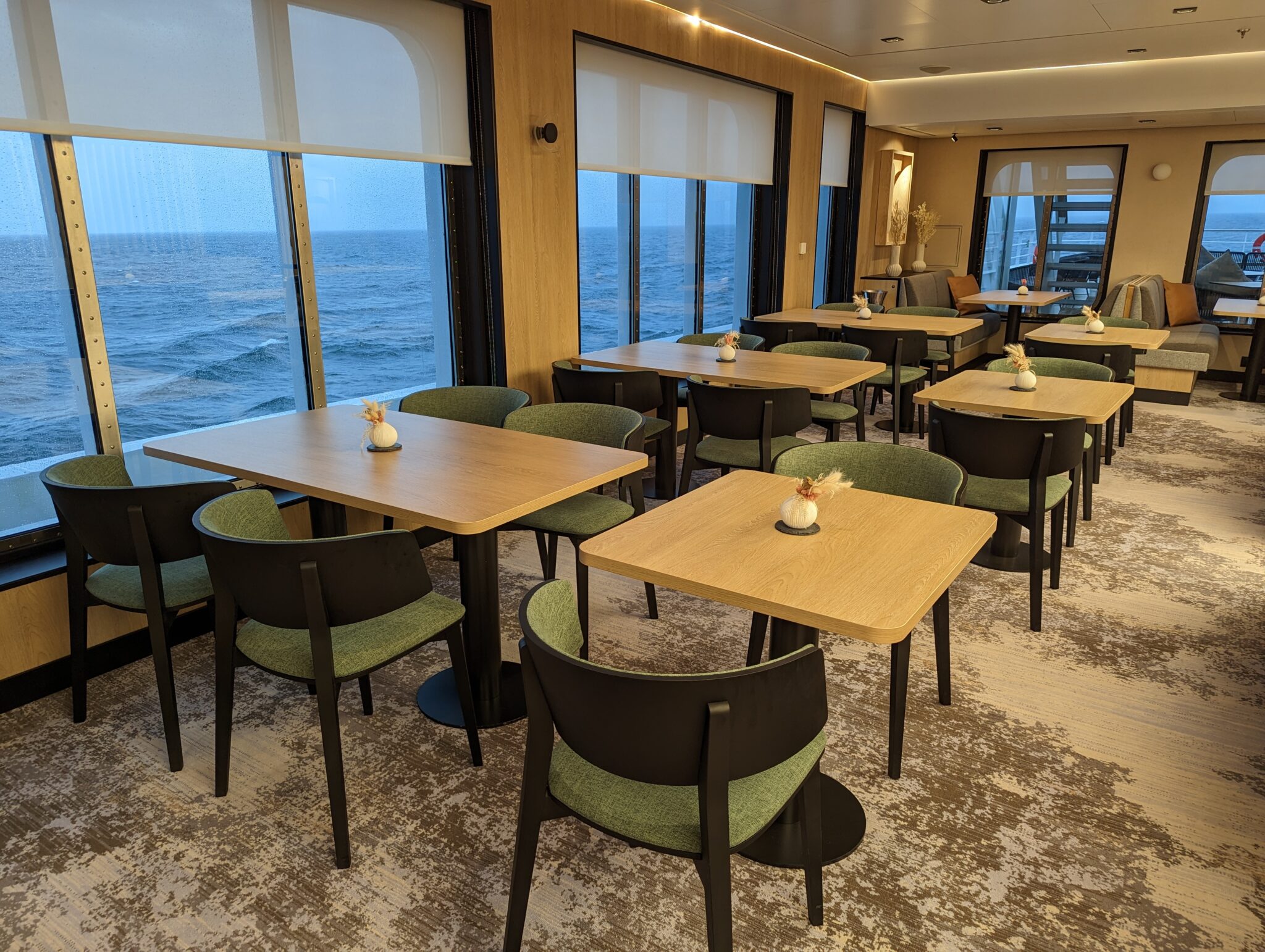 a room with tables and chairs on the floor