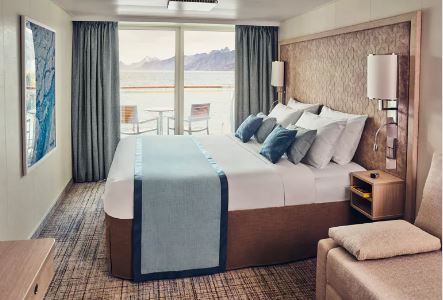a room with a bed and a window