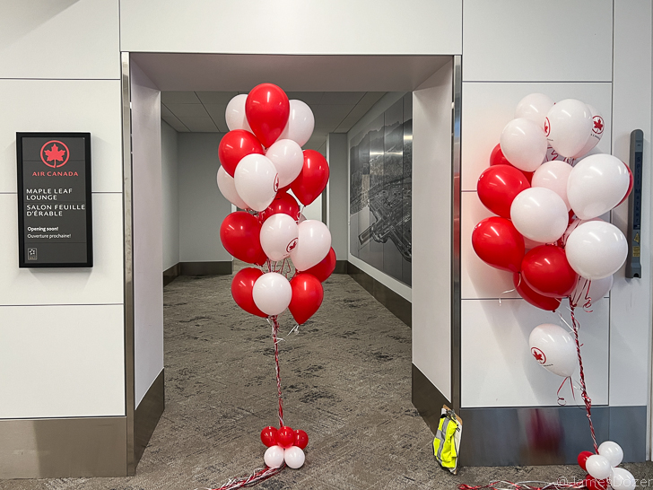 a bunch of balloons in a hallway