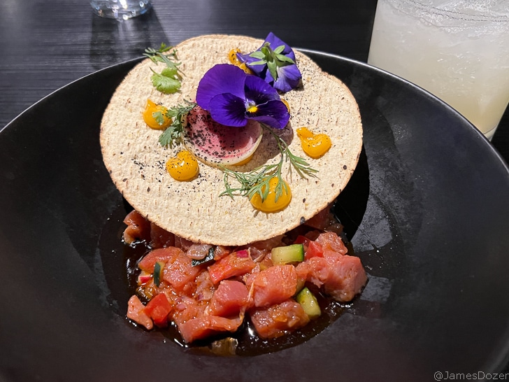 a plate of food with a tortilla on top