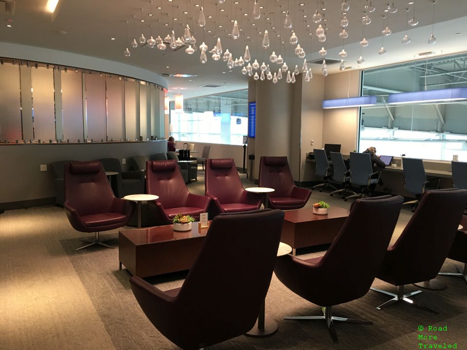 The Club MSY - main seating area and recliners along wall