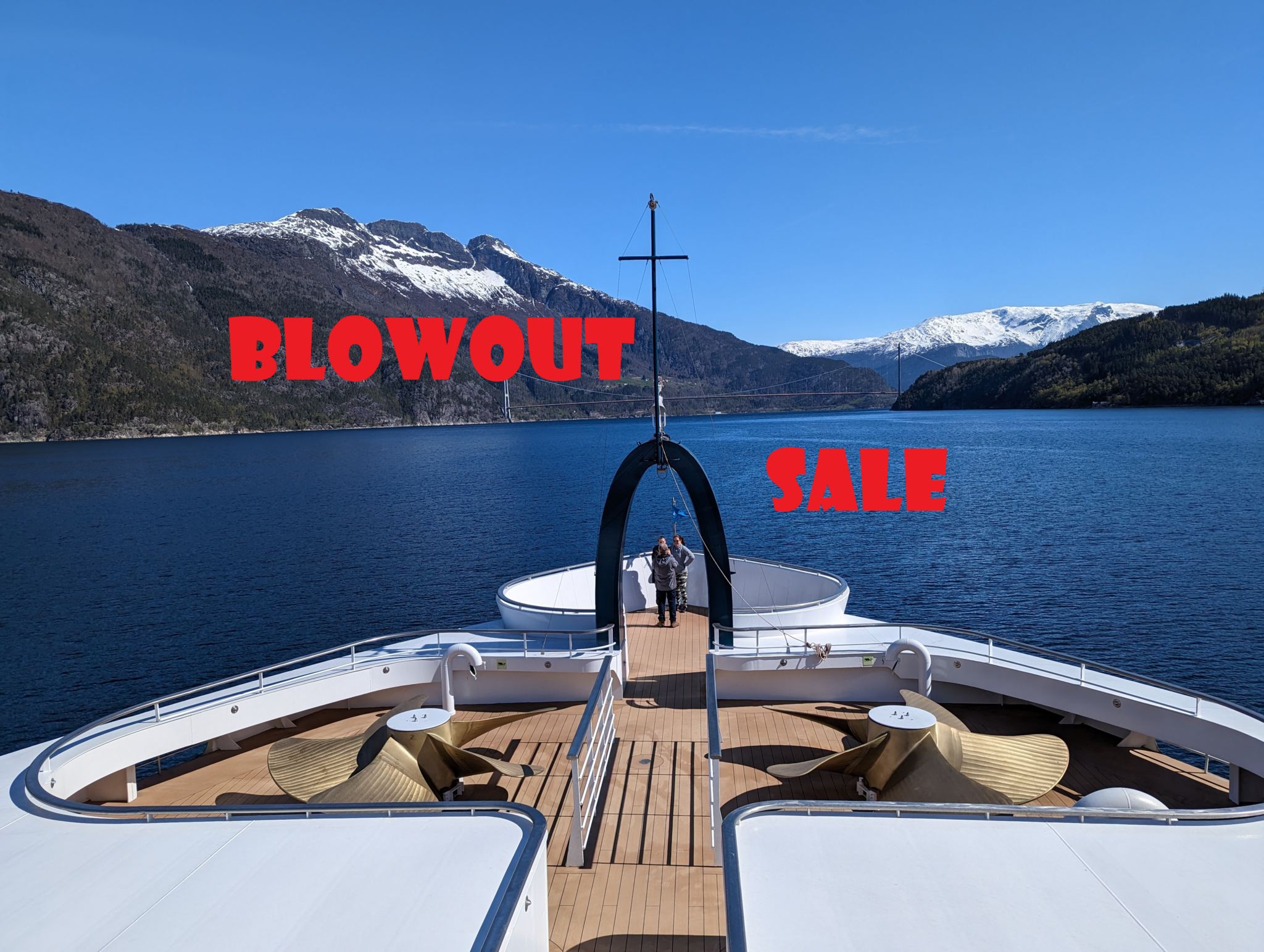 a boat on the water with mountains in the background