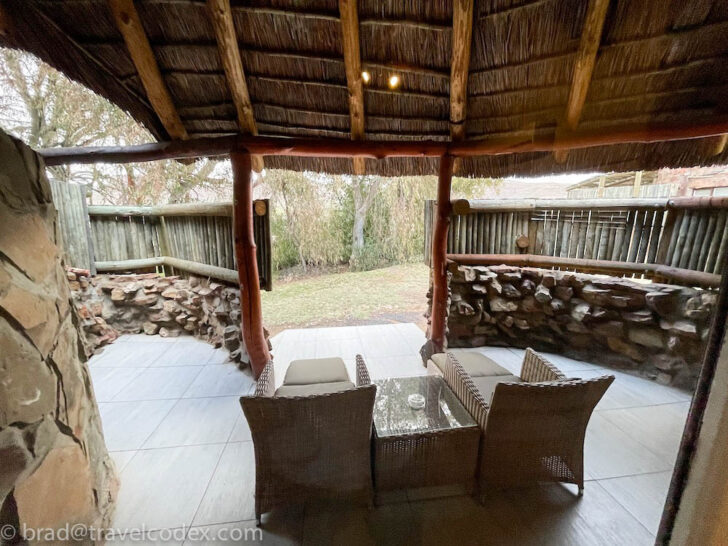 a patio with a table and chairs