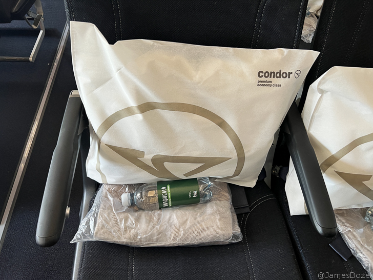 a white bag with a bottle in it