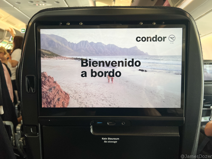 a screen on the seat of an airplane