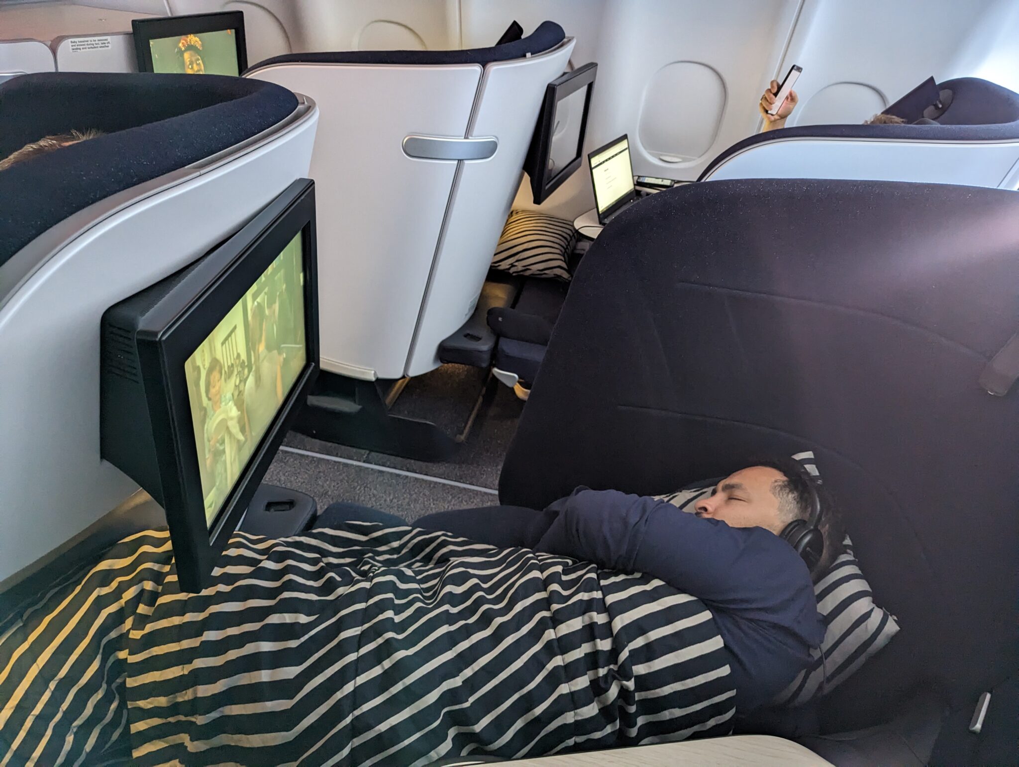 a man sleeping in a plane