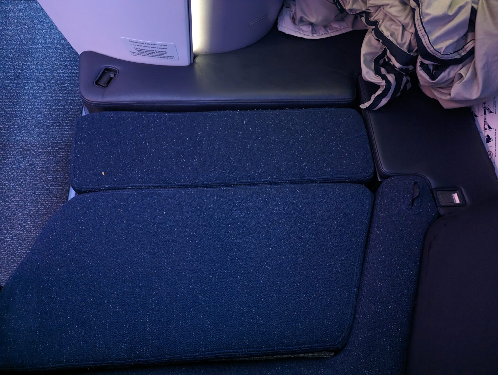 a blue cushion on a seat