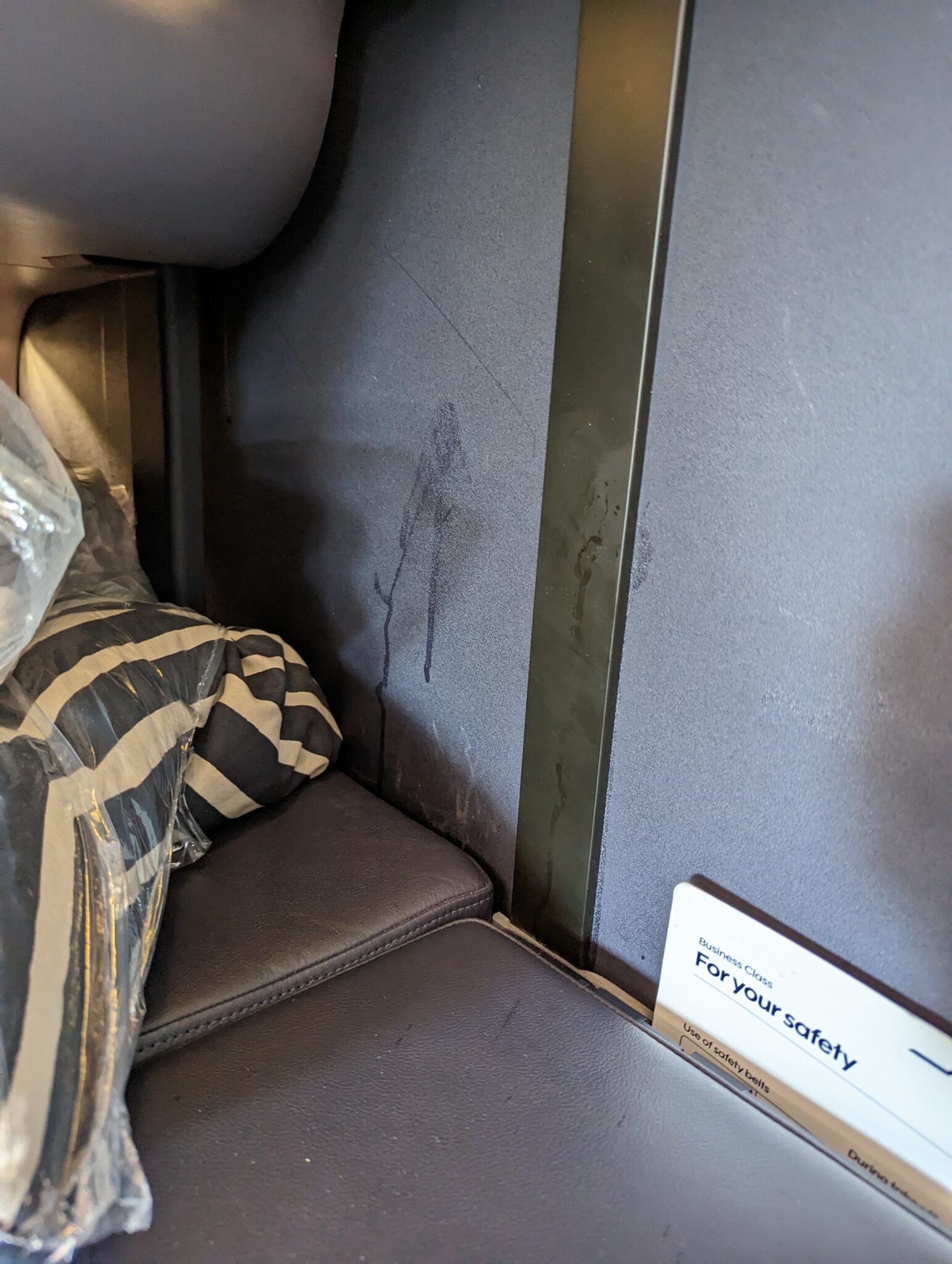 a seat with a sign on the side