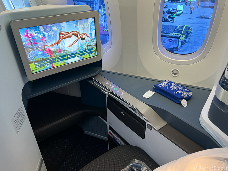 a tv on a table in an airplane