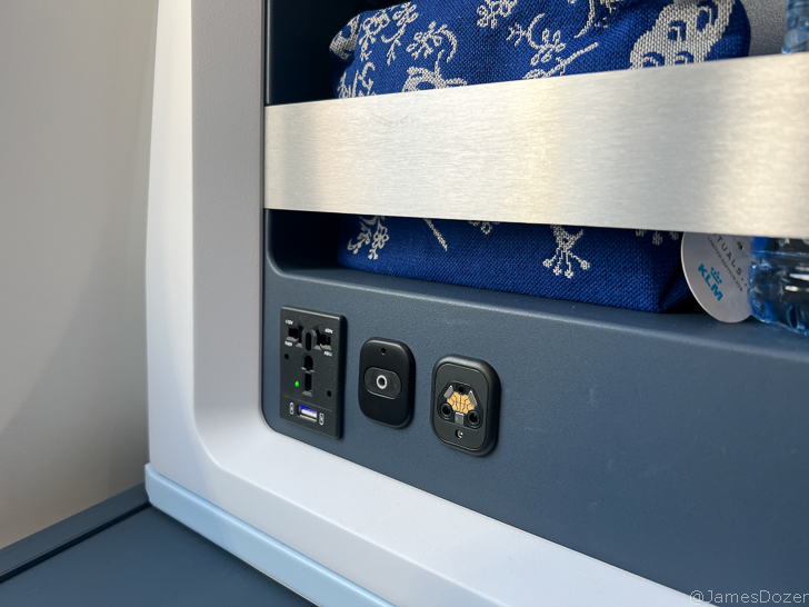 a blue blanket with white and black plugs