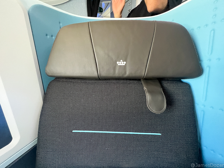 a seat with a headrest on top of it