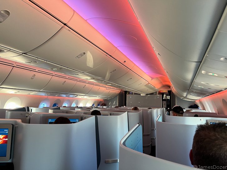 a plane with seats and people in the back