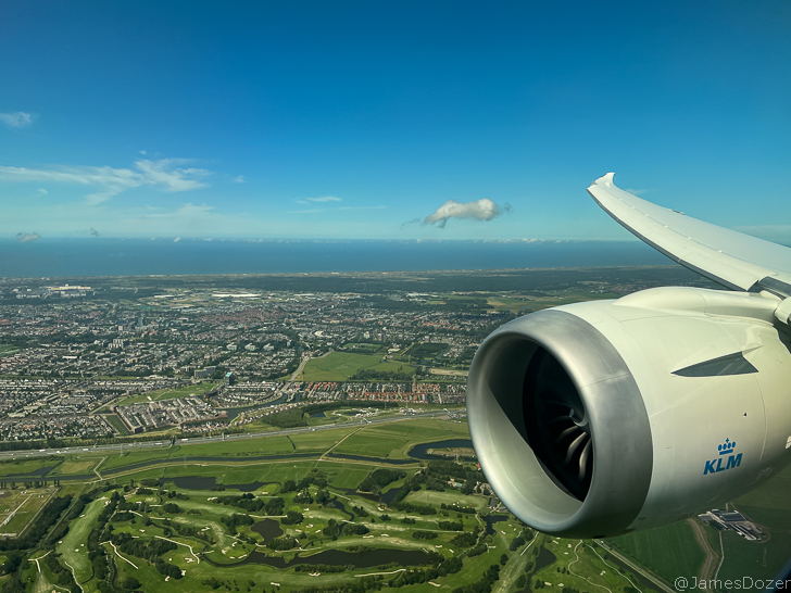 an airplane wing and a city