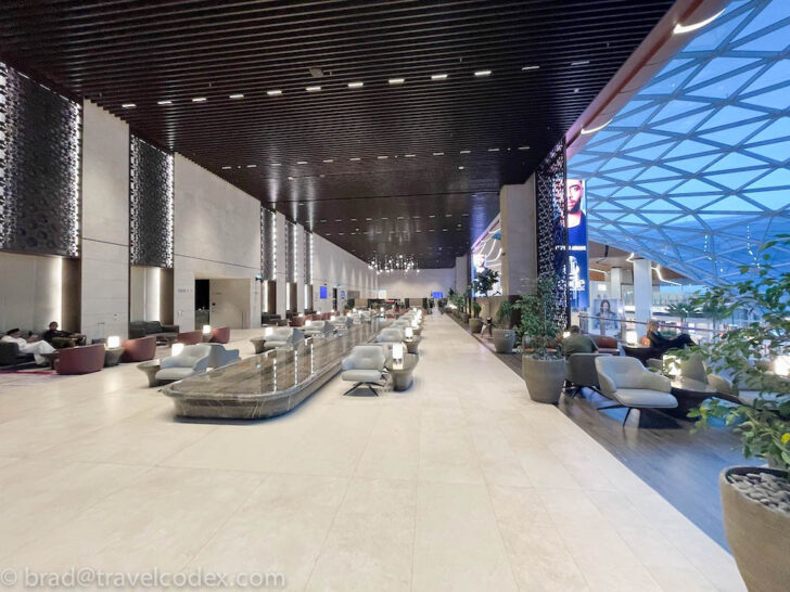 a large lobby with a large glass ceiling